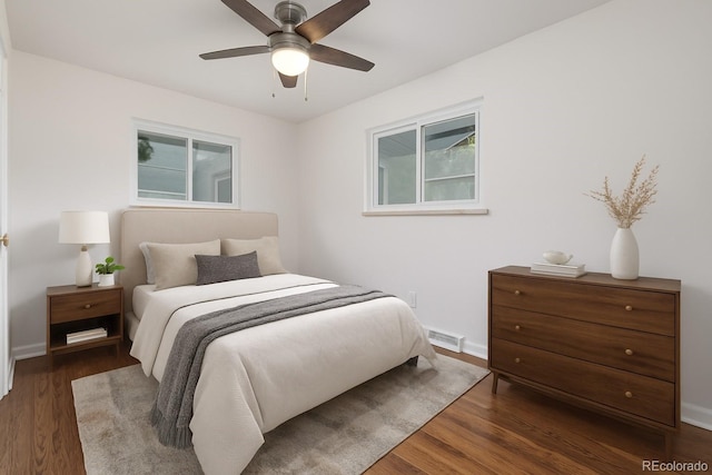 2644 S Krameria St, Denver, CO 80222 - bedroom featuring wood finished floors, multiple windows, baseboards, and ceiling fan