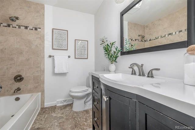 2644 S Krameria St, Denver, CO 80222 - bathroom with vanity, toilet, baseboards, and shower / washtub combination