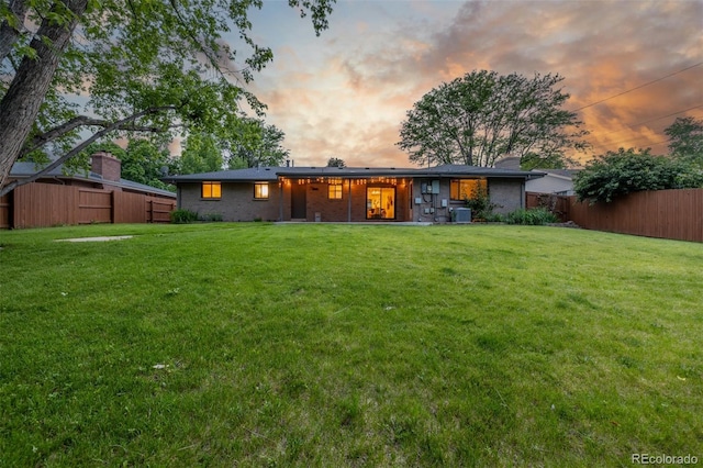 2644 S Krameria St, Denver, CO 80222 - rear view of house featuring central AC unit and brick siding