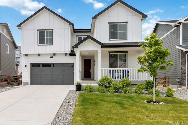 1369 E Witherspoon Dr, Elizabeth, CO 80107 - modern inspired farmhouse with board and batten siding, a porch, an attached garage, driveway, and a front lawn