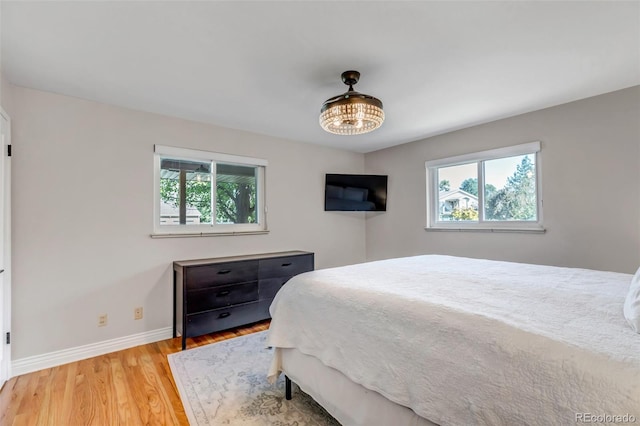 bedroom with light hardwood / wood-style flooring