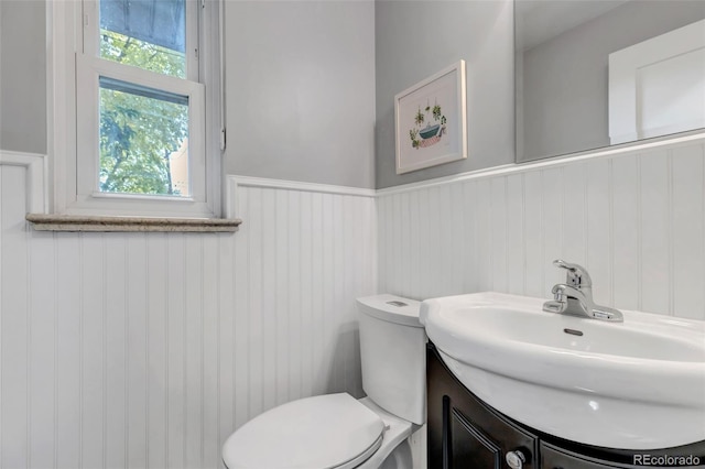 bathroom featuring vanity and toilet