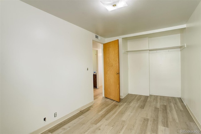 7291 Bryant St, Westminster, CO 80030 - unfurnished bedroom featuring light wood-style floors, a closet, and baseboards