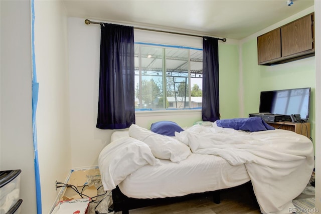 7291 Bryant St, Westminster, CO 80030 - bedroom featuring wood finished floors and baseboards
