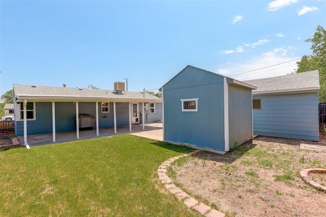 7291 Bryant St, Westminster, CO 80030 - rear view of house featuring a patio area, an outbuilding, and a lawn