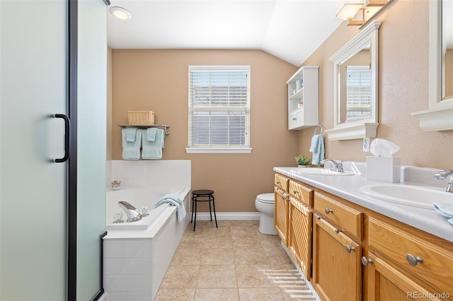 full bathroom with a garden tub, toilet, a sink, baseboards, and double vanity