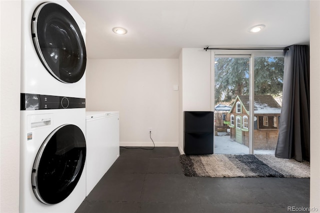 laundry area featuring stacked washing maching and dryer