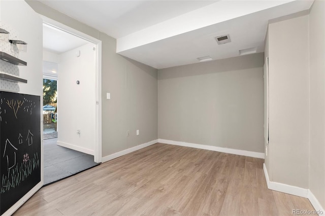 unfurnished room with light hardwood / wood-style flooring