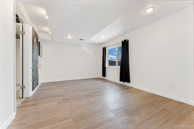 spare room featuring light hardwood / wood-style floors