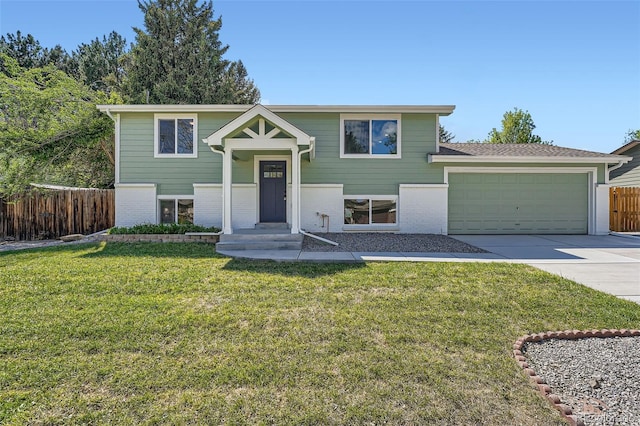 1183 S Pierson Ct, Denver, CO 80232 - raised ranch with concrete driveway, brick siding, and an attached garage