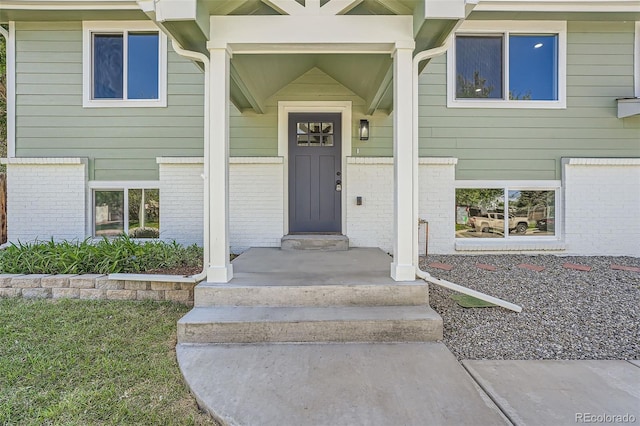 1183 S Pierson Ct, Denver, CO 80232 - doorway to property with brick siding