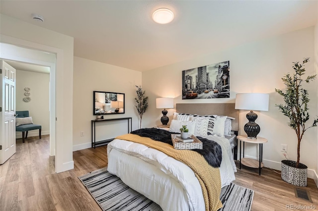 1183 S Pierson Ct, Denver, CO 80232 - bedroom with wood finished floors and baseboards