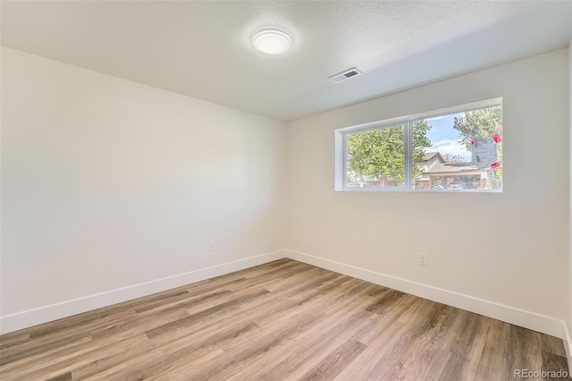 1183 S Pierson Ct, Denver, CO 80232 - spare room featuring baseboards and light wood-style floors