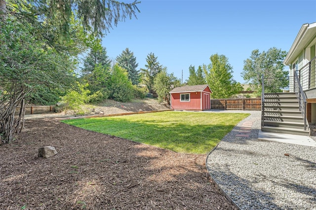1183 S Pierson Ct, Denver, CO 80232 - view of yard featuring an outbuilding and stairway