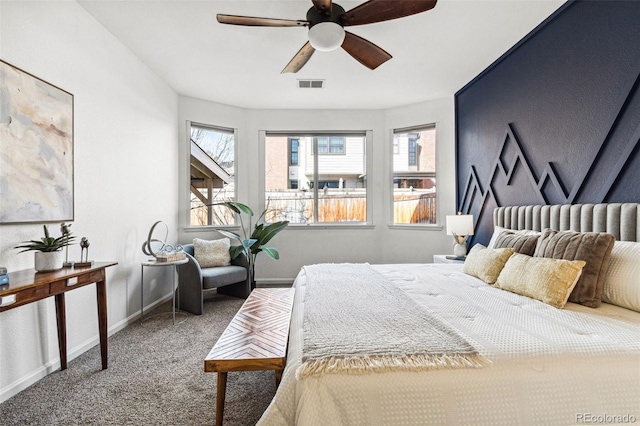 bedroom featuring a ceiling fan, baseboards, visible vents, and carpet floors