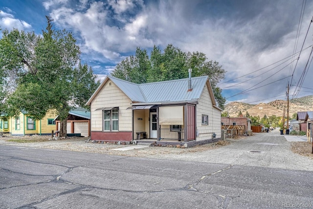 view of front of house featuring a mountain view and covered porch