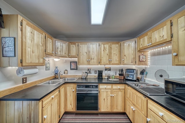 kitchen with backsplash, sink, light brown cabinets, and oven