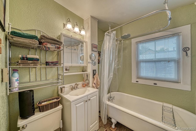 full bathroom with shower / bathtub combination with curtain, vanity, and toilet