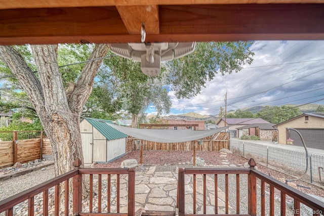 view of patio with a storage shed