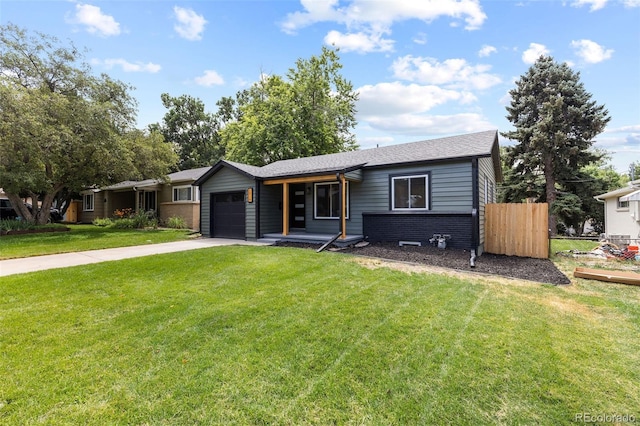 1310 E Amherst Ave, Englewood, CO 80113 - view of front of home with driveway, a garage, and brick siding