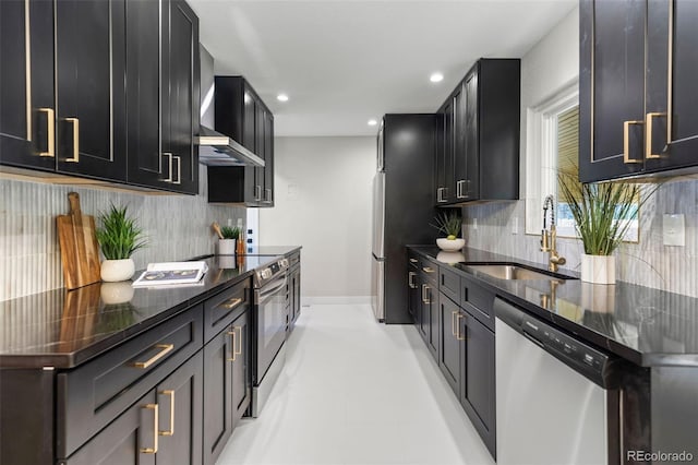 1310 E Amherst Ave, Englewood, CO 80113 - kitchen with stainless steel appliances, backsplash, recessed lighting, dark cabinetry, and dark stone countertops