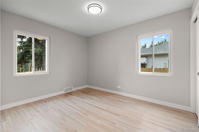 1310 E Amherst Ave, Englewood, CO 80113 - spare room featuring healthy amount of natural light and wood finished floors