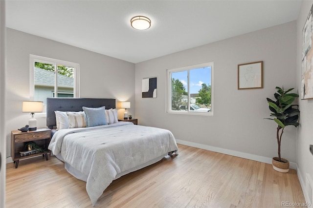 1310 E Amherst Ave, Englewood, CO 80113 - bedroom featuring baseboards and light wood-style floors