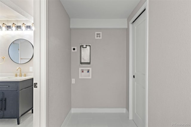 1310 E Amherst Ave, Englewood, CO 80113 - hallway with a sink and light tile patterned flooring