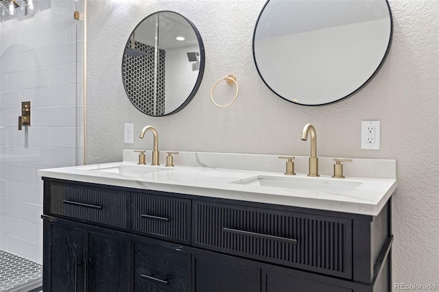 1310 E Amherst Ave, Englewood, CO 80113 - bathroom featuring a textured wall and double vanity