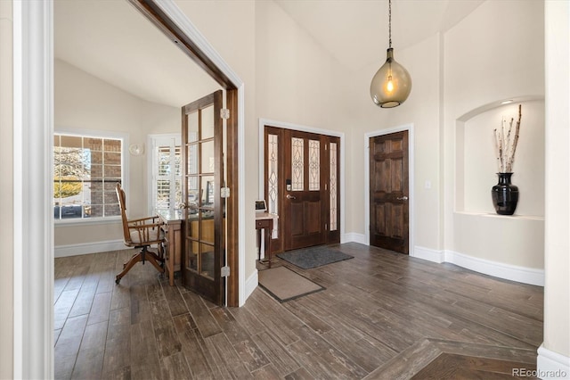 10044 E 146th Pl, Brighton, CO 80602 - foyer featuring baseboards, dark wood finished floors, and high vaulted ceiling