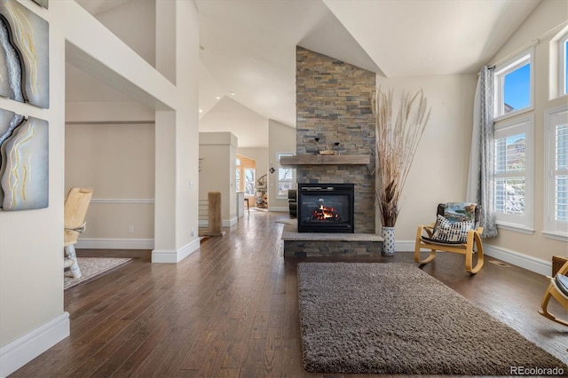 10044 E 146th Pl, Brighton, CO 80602 - living area with baseboards, a stone fireplace, hardwood / wood-style flooring, and high vaulted ceiling