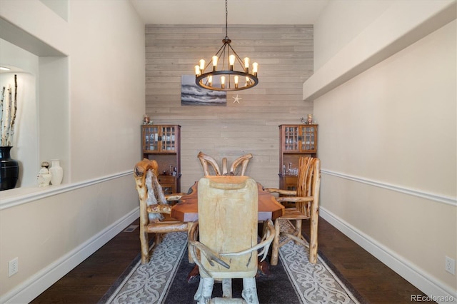 10044 E 146th Pl, Brighton, CO 80602 - dining area with baseboards, wood walls, dark wood-style flooring, and a chandelier