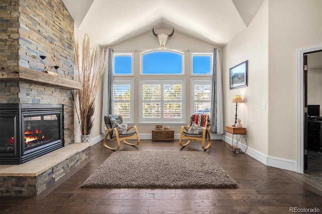10044 E 146th Pl, Brighton, CO 80602 - sitting room with baseboards, high vaulted ceiling, hardwood / wood-style flooring, and a fireplace