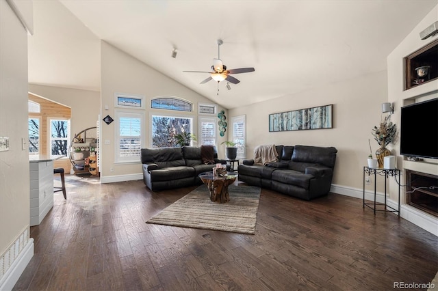 10044 E 146th Pl, Brighton, CO 80602 - living area with high vaulted ceiling, ceiling fan, baseboards, and dark wood-style floors