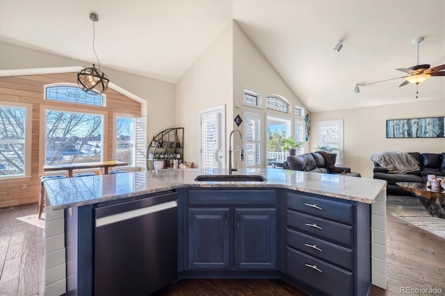 10044 E 146th Pl, Brighton, CO 80602 - kitchen featuring a sink, stainless steel dishwasher, vaulted ceiling, and blue cabinets