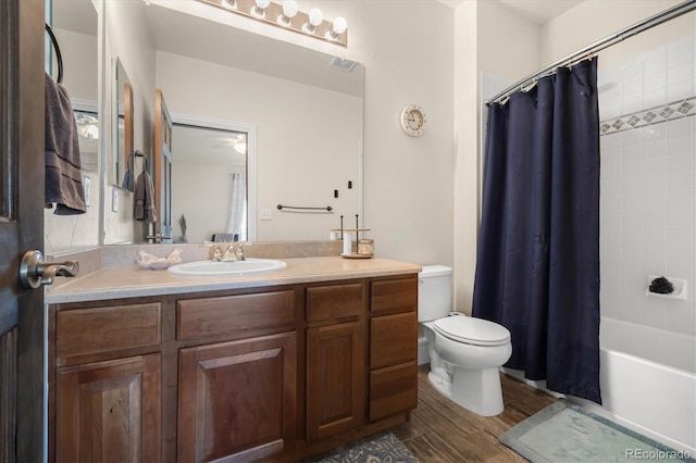 10044 E 146th Pl, Brighton, CO 80602 - full bathroom with ceiling fan, wood finished floors, vanity, toilet, and shower / tub combo with curtain