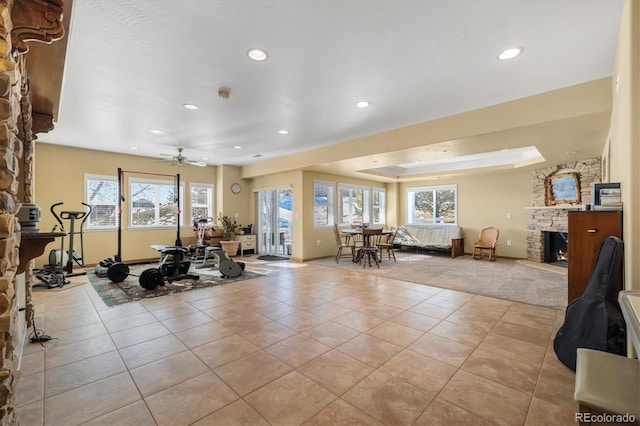 10044 E 146th Pl, Brighton, CO 80602 - exercise area featuring light tile patterned floors, a fireplace, recessed lighting, and a wealth of natural light