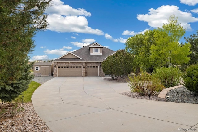 10044 E 146th Pl, Brighton, CO 80602 - view of front facade featuring an attached garage, brick siding, a shed, an outdoor structure, and driveway