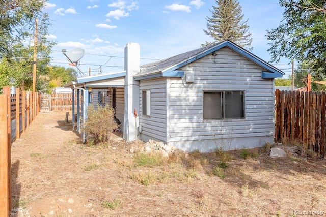 exterior space featuring a storage unit