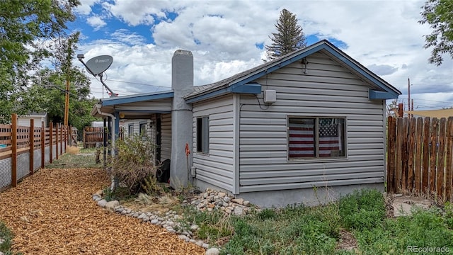1320 H St, Salida, CO 81201 - view of home's exterior featuring a chimney