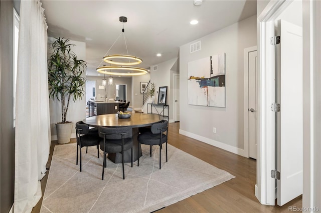 dining space featuring light wood-type flooring