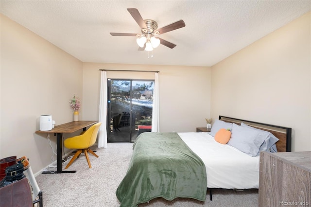 bedroom featuring access to outside, ceiling fan, carpet, and a textured ceiling