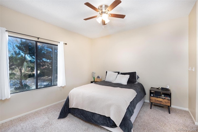 bedroom with ceiling fan and carpet