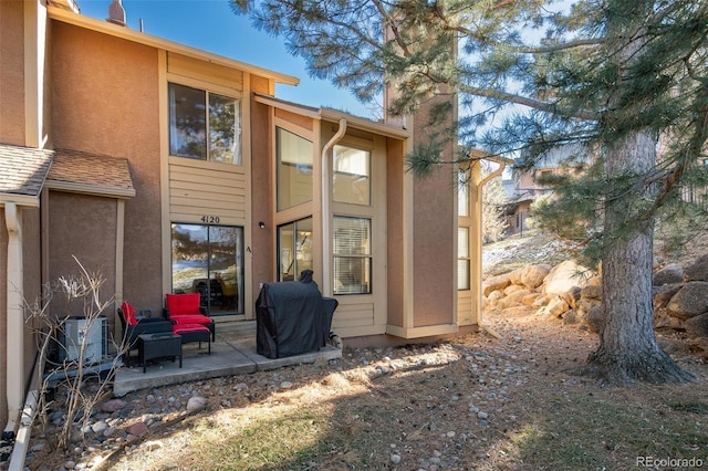 rear view of house with a patio