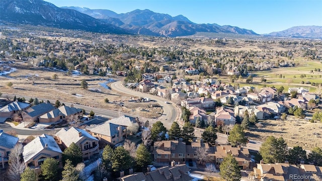 birds eye view of property featuring a mountain view