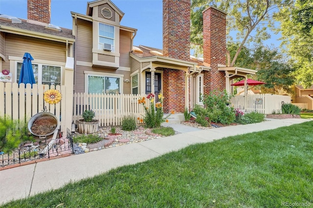 14243 E Radcliff Cir, Aurora, CO 80015 - view of front of home featuring a chimney and brick siding