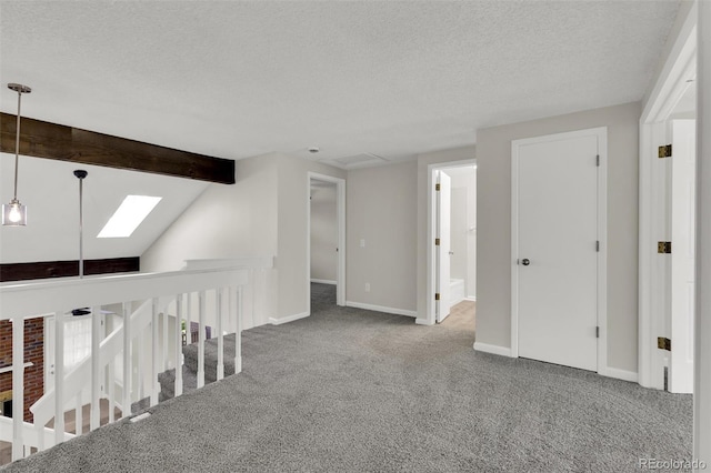14243 E Radcliff Cir, Aurora, CO 80015 - hallway featuring carpet, a skylight, a textured ceiling, and an upstairs landing