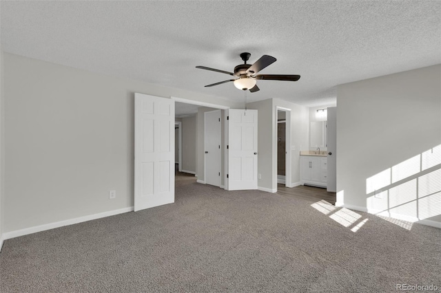 14243 E Radcliff Cir, Aurora, CO 80015 - unfurnished living room with ceiling fan, carpet floors, and a textured ceiling