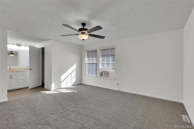 14243 E Radcliff Cir, Aurora, CO 80015 - unfurnished bedroom with carpet floors, cooling unit, a textured ceiling, and ceiling fan