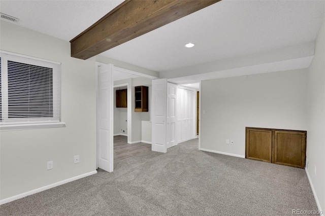 14243 E Radcliff Cir, Aurora, CO 80015 - spare room featuring carpet floors, recessed lighting, and beamed ceiling